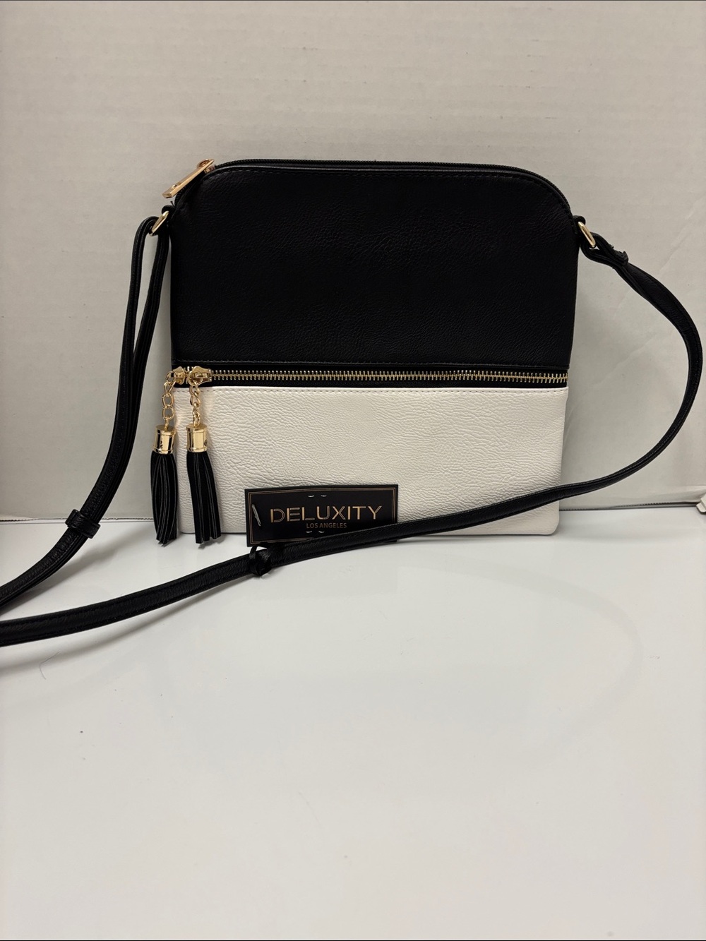 Deluxity Two-Tone Black & White Crossbody with Tassel Zips